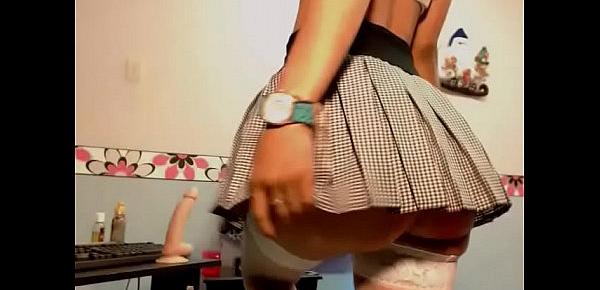  Young girl in mini skirt masturbating with thick dildo
